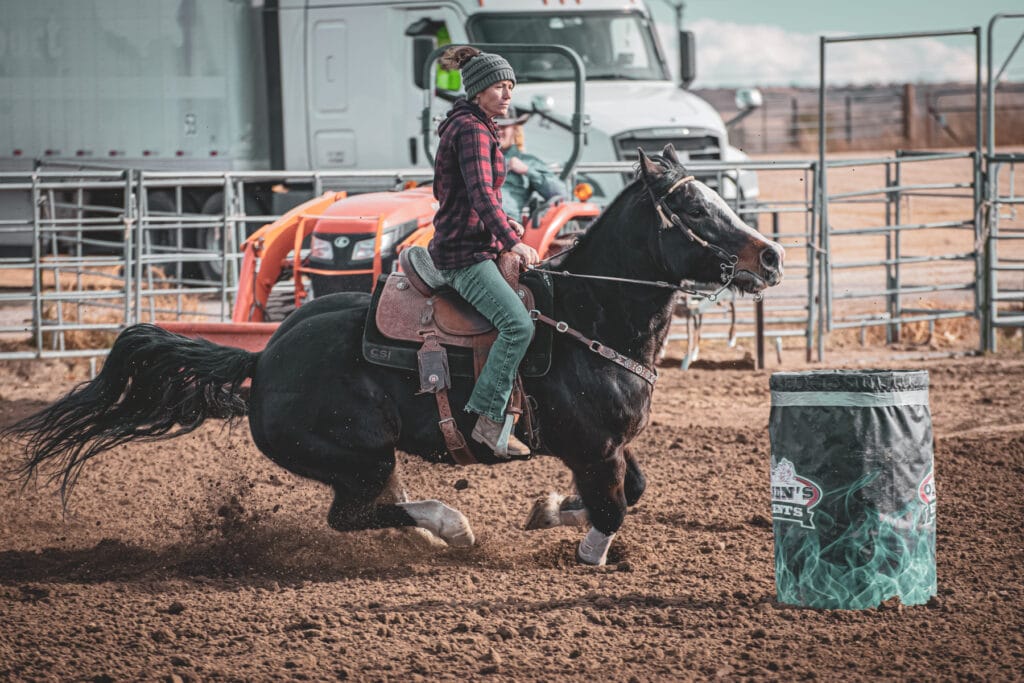 Women riding horse at Olsen Event Center
